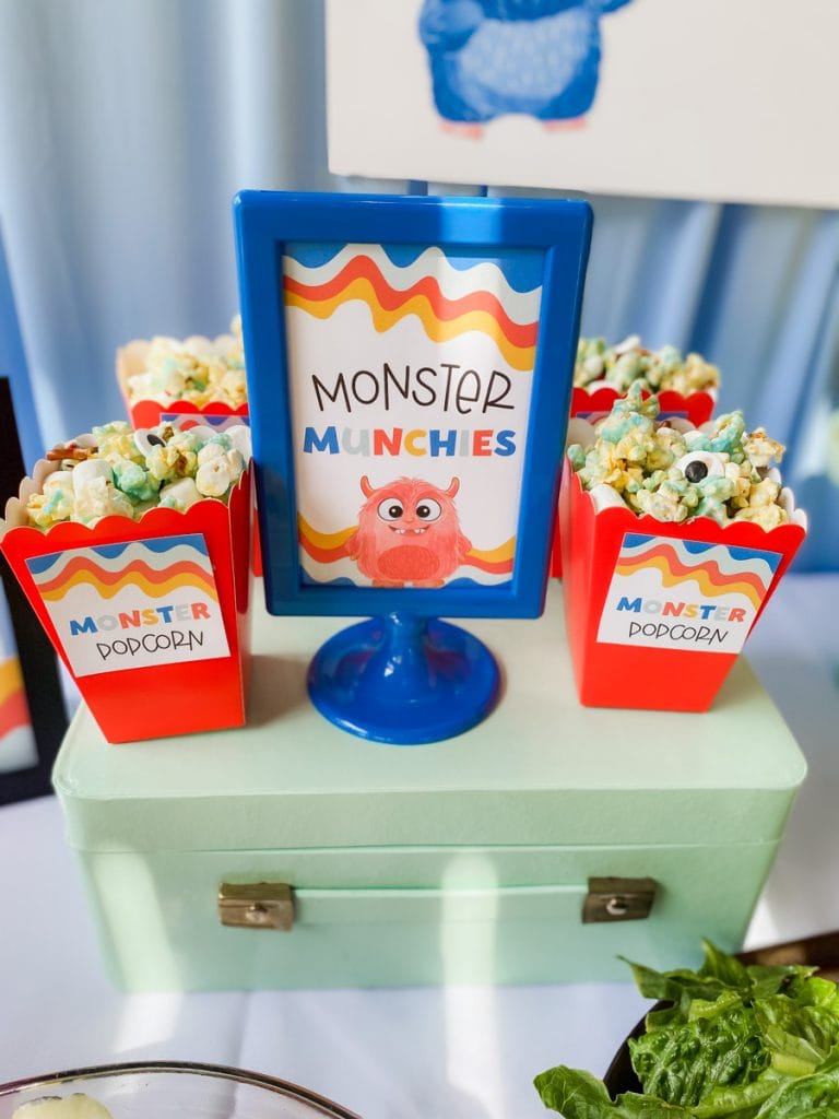 Monster Popcorn in mini red boxes with a Monster Munchies printable sign