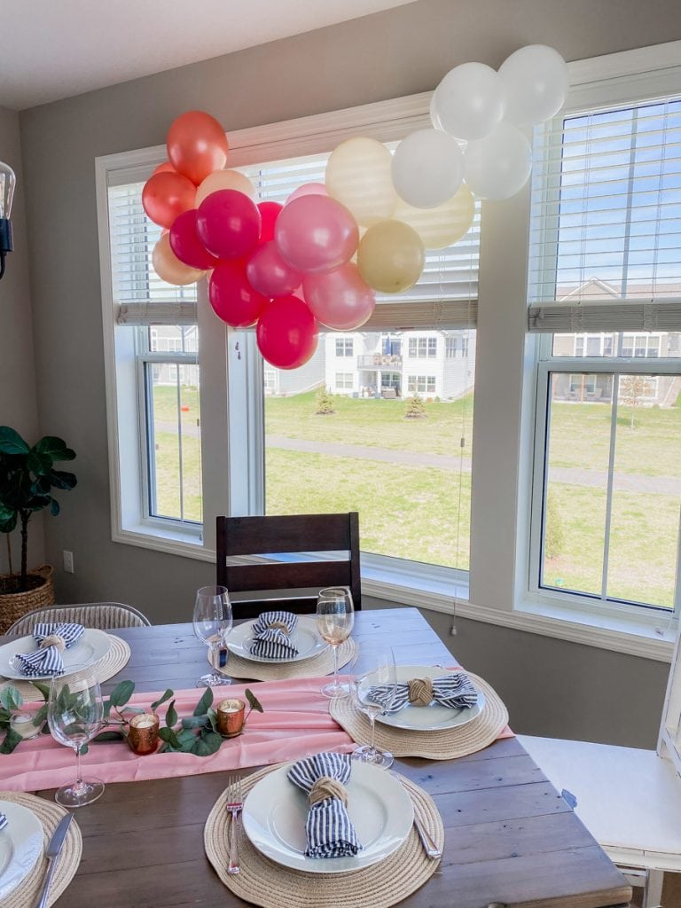 Mother's Day Brunch table with pink ombre balloon garland