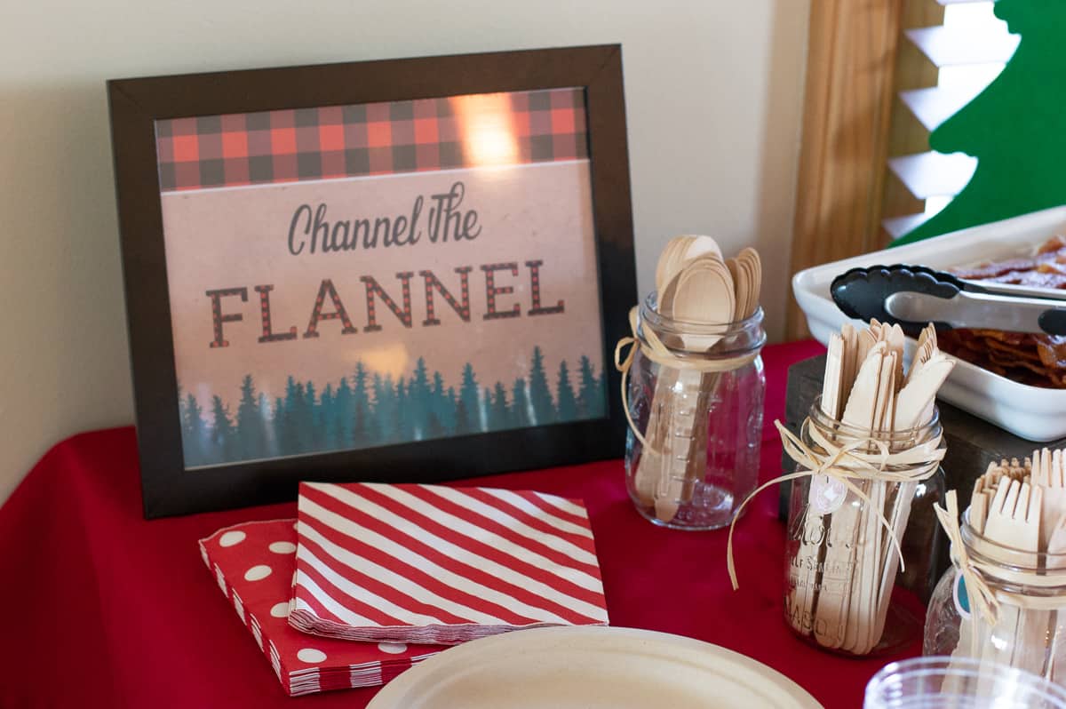 Channel the Flannel party sign with wood cutlery