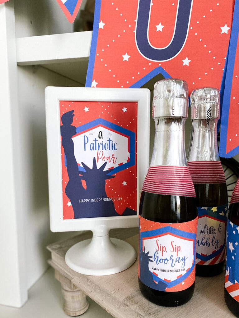 Lady Liberty mini champagne bottle labels for a 4th of July happy hour, printed and wrapped around mini bottles