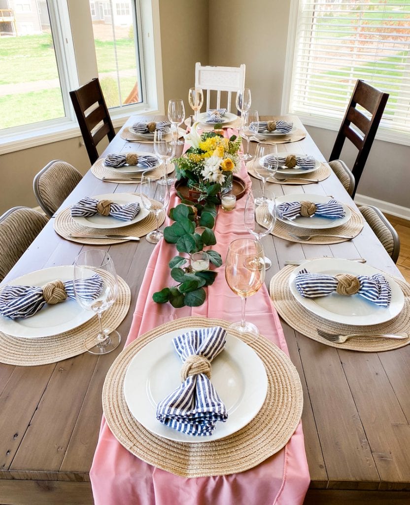 Mother's Day Brunch and Bouquets tablescape with pink runner and striped napkins