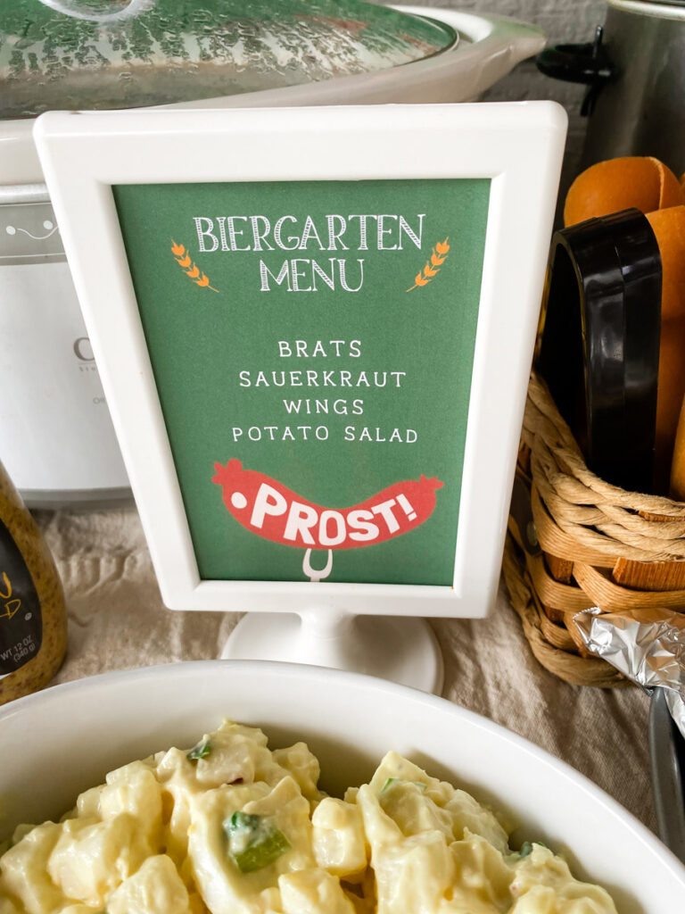 Biergarten Menu printable sign with a cute prost hot dog design listing brats, sauerkraut, wings, and potato salad