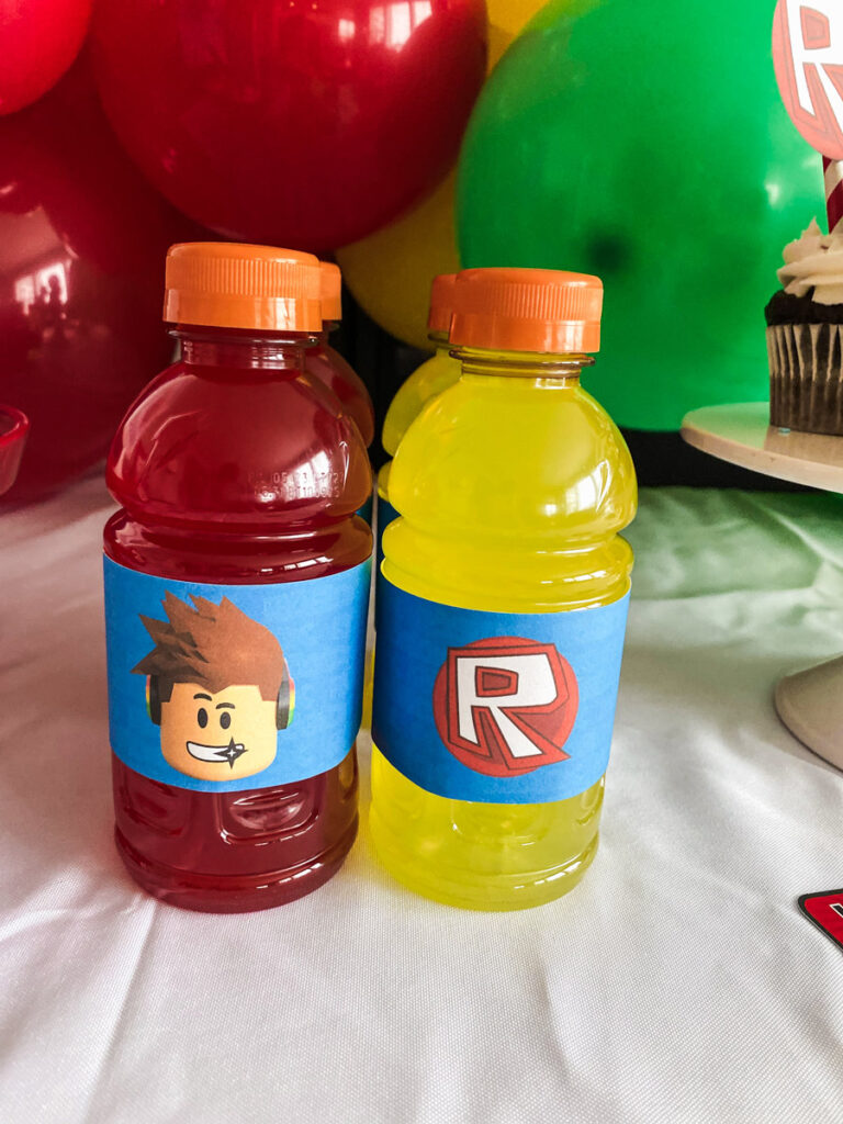 Custom Roblox birthday party labels on Gatorade bottles — Roblox character face design and Roblox R logo design on blue backgrounds