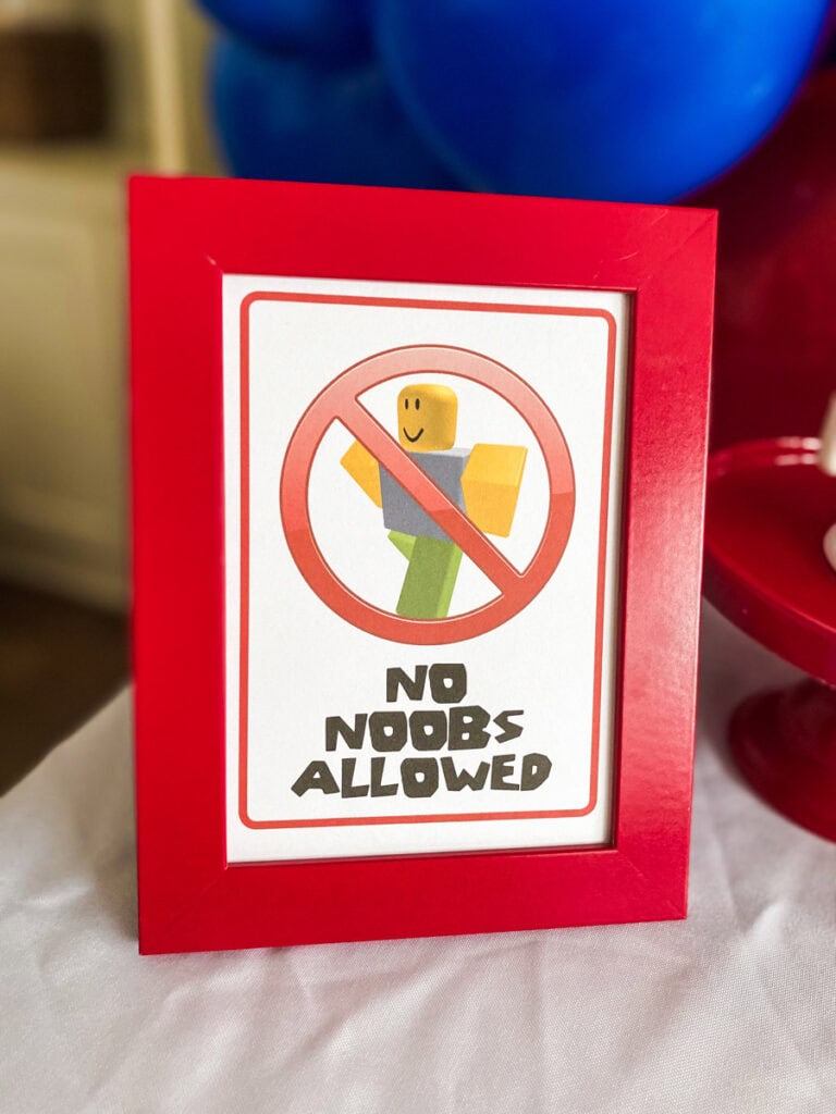 No Noobs Allowed Roblox birthday party printable sign close-up in red frame with noob character and red circle-slash graphic