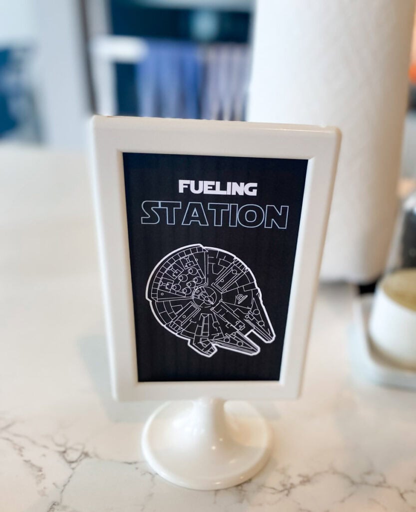 Fueling Station printable sign with Millennium Falcon illustration at Star Wars birthday party drink station